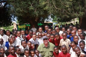 LIFE Founder, Malcolm MacKillop interacts with children at a school supported by World Vision in Tanzania